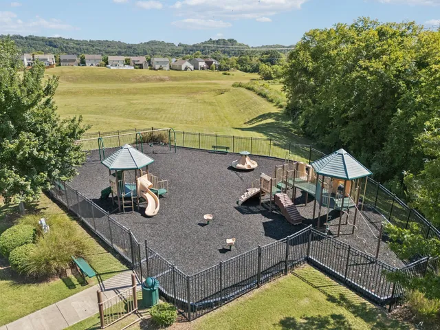 an aerial view of a house with swimming pool and ocean view