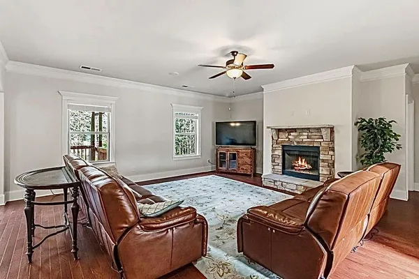 a bedroom with furniture and a flat screen tv