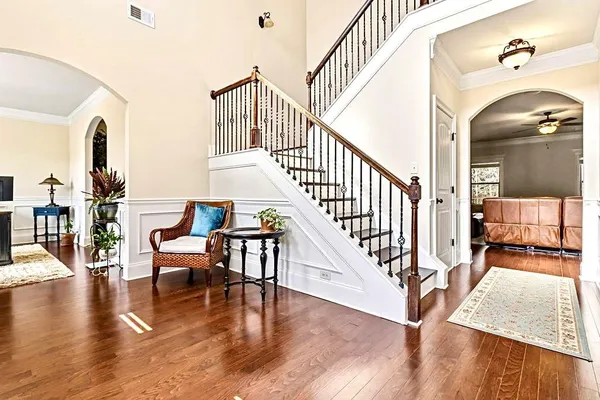 a living room with fireplace furniture and a flat screen tv