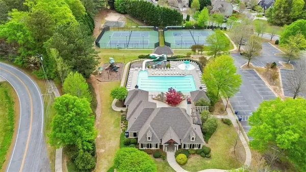 an aerial view of a house with a yard