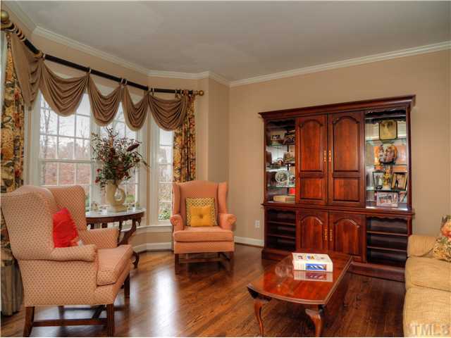 5528 Overleaf Court Raleigh, NC 27615 - Photo 12 of 25 a living room with furniture a window and a potted plant