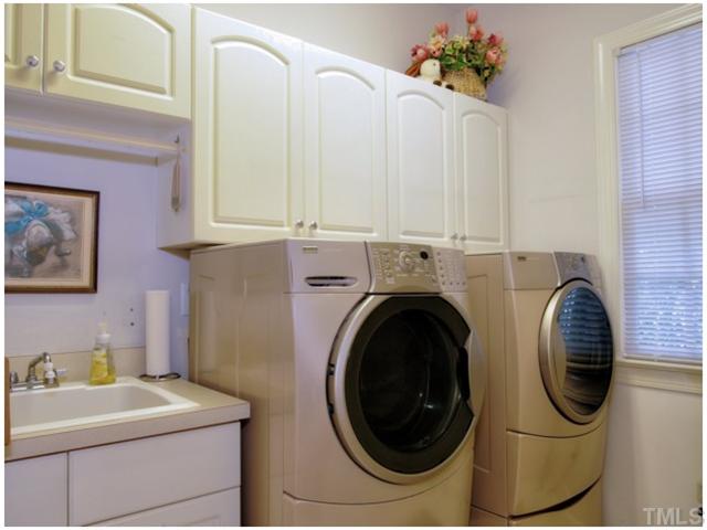 5528 Overleaf Court Raleigh, NC 27615 - Photo 14 of 25 a utility room with dryer and washer