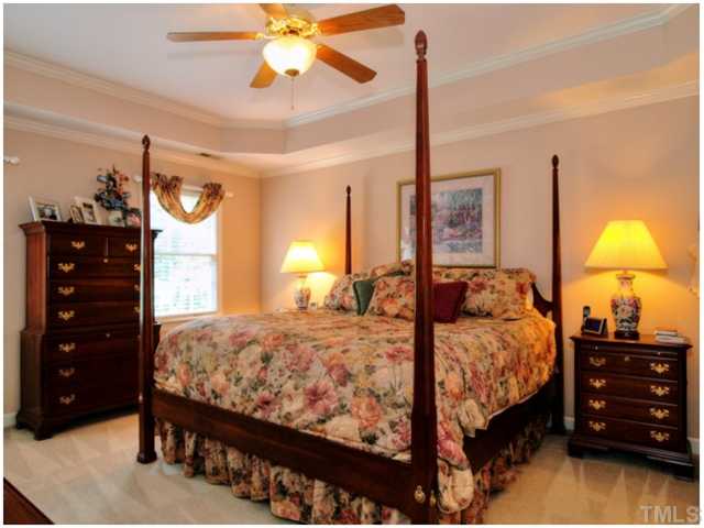 5528 Overleaf Court Raleigh, NC 27615 - Photo 15 of 25 a bedroom with a bed and a closet
