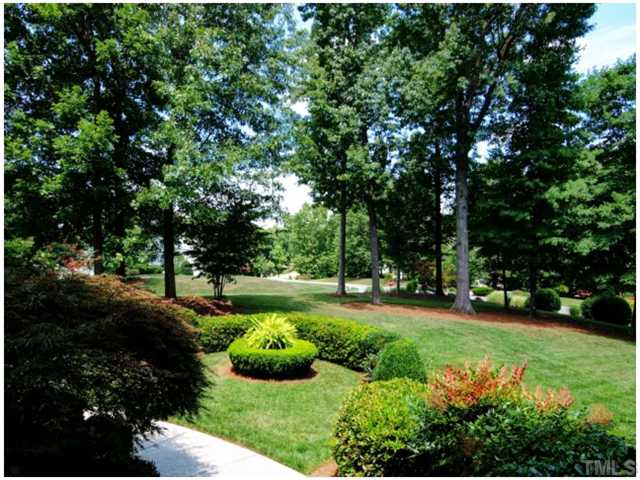 5528 Overleaf Court Raleigh, NC 27615 - Photo 25 of 25 a view of a garden with large trees