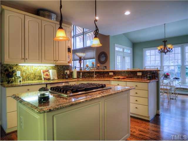 5528 Overleaf Court Raleigh, NC 27615 - Photo 5 of 25 a kitchen with a sink a counter space appliances and cabinets