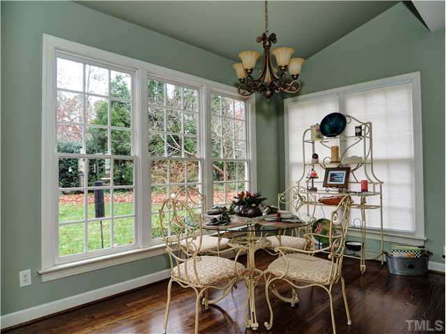 5528 Overleaf Court Raleigh, NC 27615 - Photo 7 of 25 a view of a dining room with furniture window and wooden floor