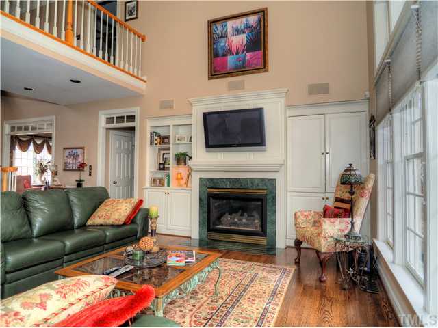 5528 Overleaf Court Raleigh, NC 27615 - Photo 8 of 25 a living room with furniture and a fireplace