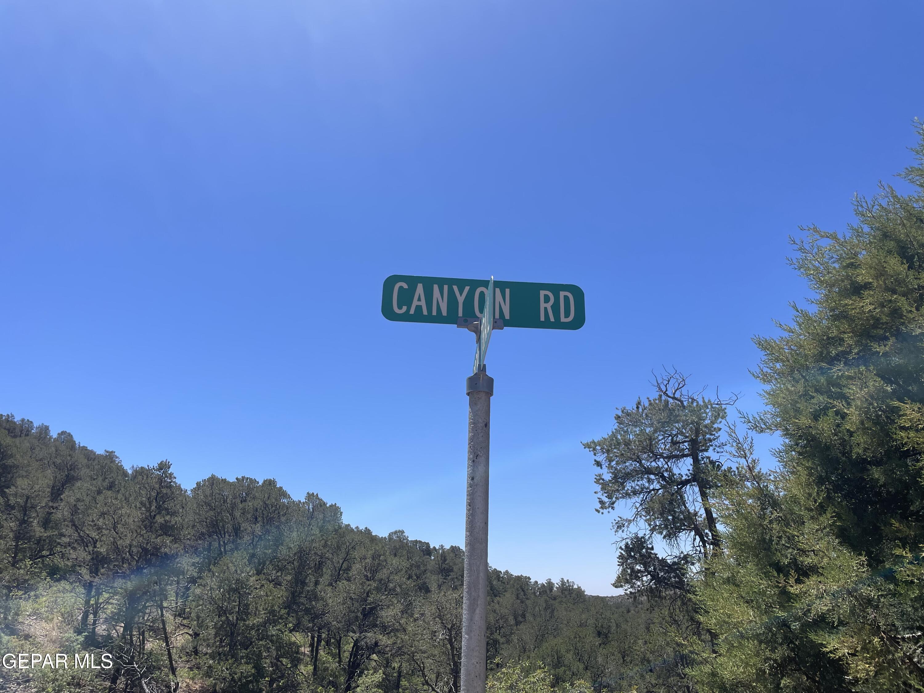 60 Canyon Road Timberon, NM 88350 - Photo 7 of 8 a street sign on a pole