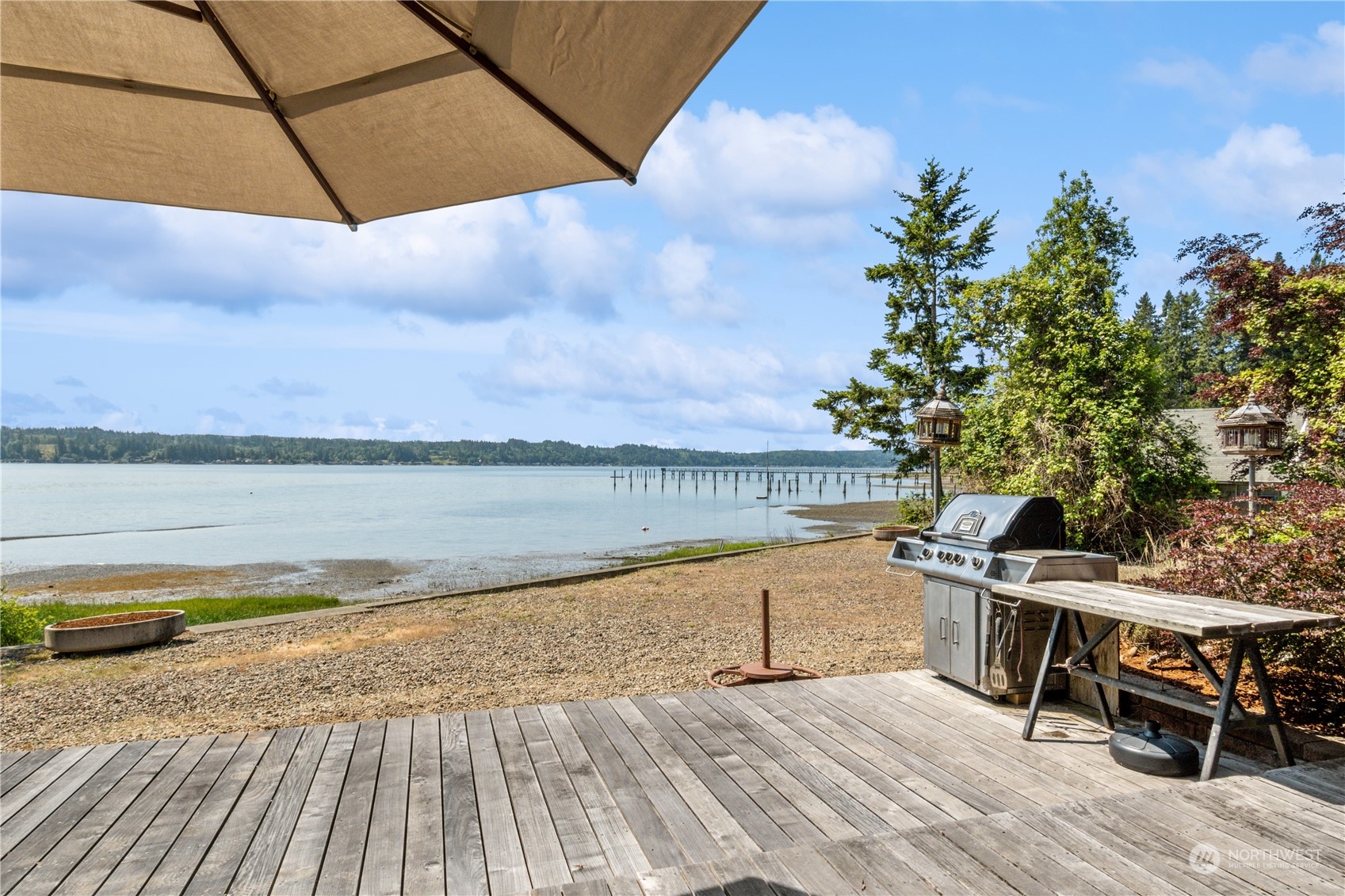 3971 Northeast North Shore Road Belfair, WA 98528 - Photo 8 of 40 a view of a terrace with wooden floor and lake view
