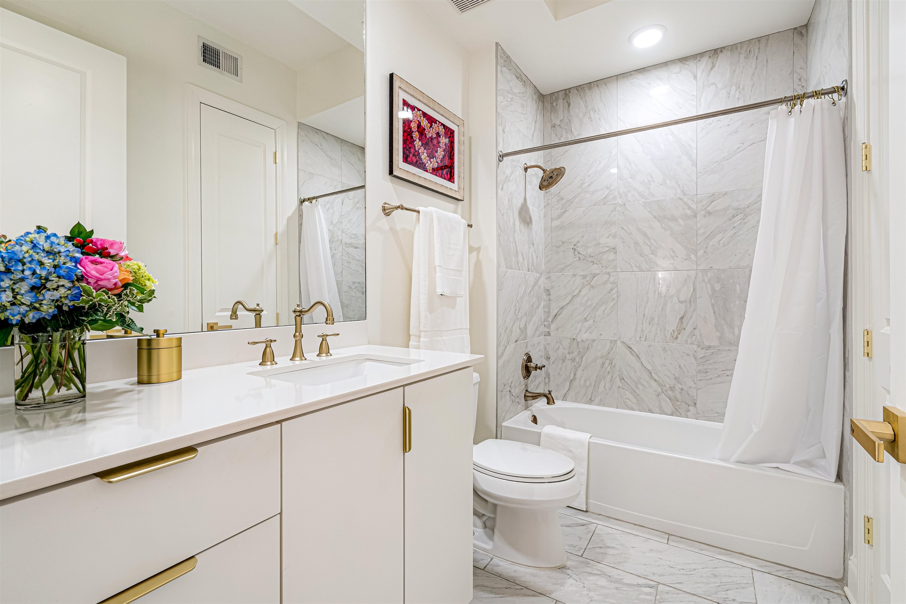 717 Riverside Drive, Unit 1205 Memphis, TN 38103 - Photo 19 of 32 Full bath featuring vanity, shower / bath combo, and light marble finish floors