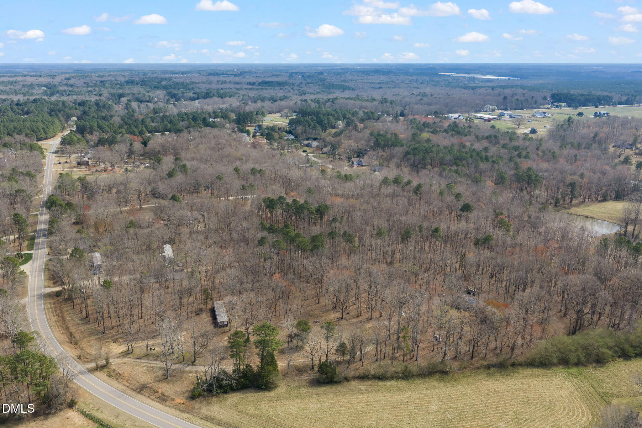 4074 Graham Sherron Road Wake Forest, NC 27587 - Photo 2 of 9 a view of a dry yard with trees