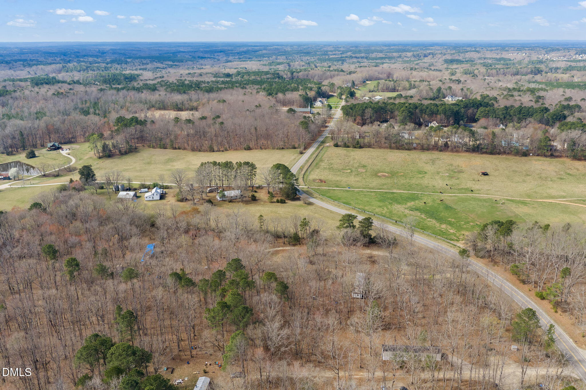 4074 Graham Sherron Road Wake Forest, NC 27587 - Photo 6 of 9 a view of a lake with a city