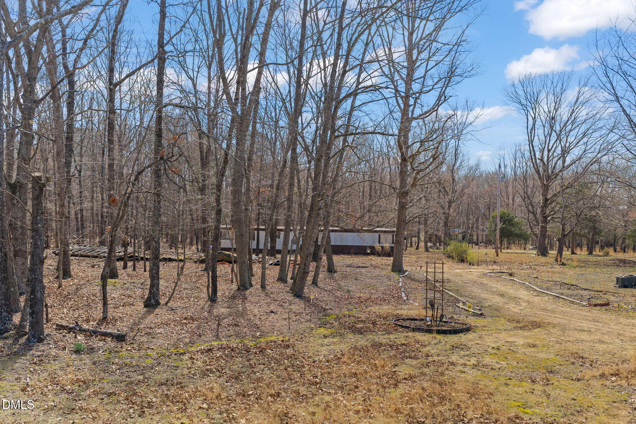 4074 Graham Sherron Road Wake Forest, NC 27587 - Photo 9 of 9 a view of outdoor space with lots of trees