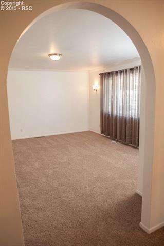 6965 Chippewa Road Colorado Springs, CO 80915 - Photo 12 of 31 Formal living room - note the crown moulding!