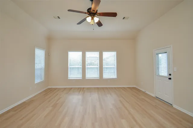 a view of an empty room with a window