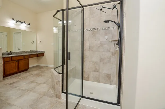 a bathroom with a tub and a shower