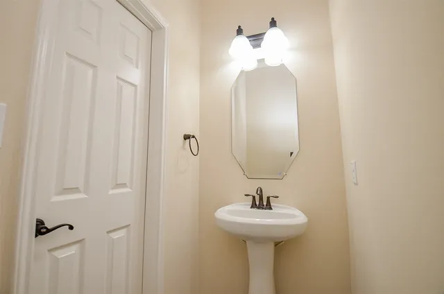 a bathroom with a sink and mirror