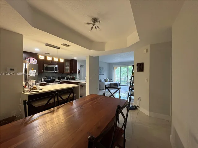 a kitchen with a table and chairs in it