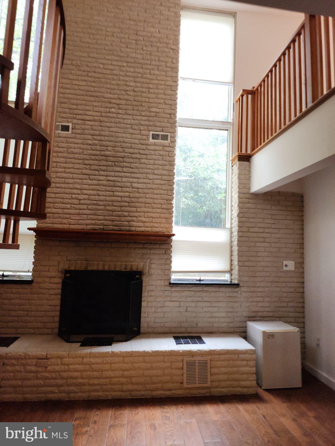 416 Marshall Manor Drive Silver Spring, MD 20905 - Photo 3 of 11 a living room with furniture and a fireplace
