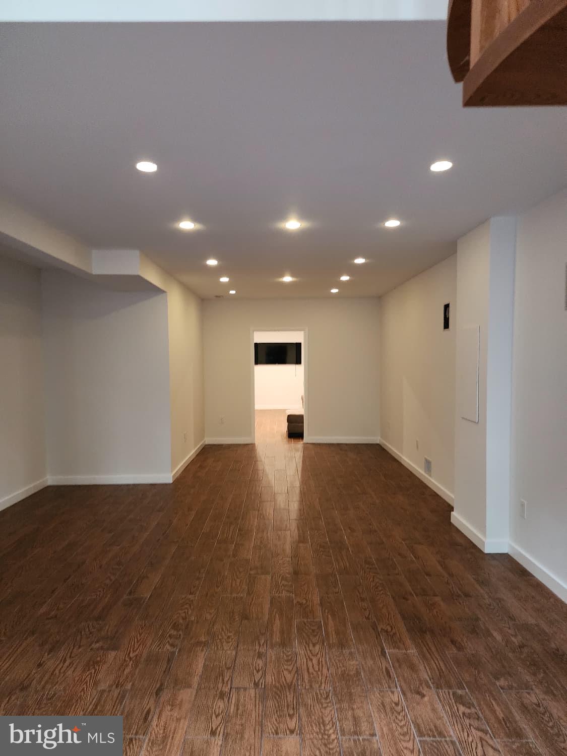 416 Marshall Manor Drive Silver Spring, MD 20905 - Photo 5 of 11 a view of empty room with wooden floor
