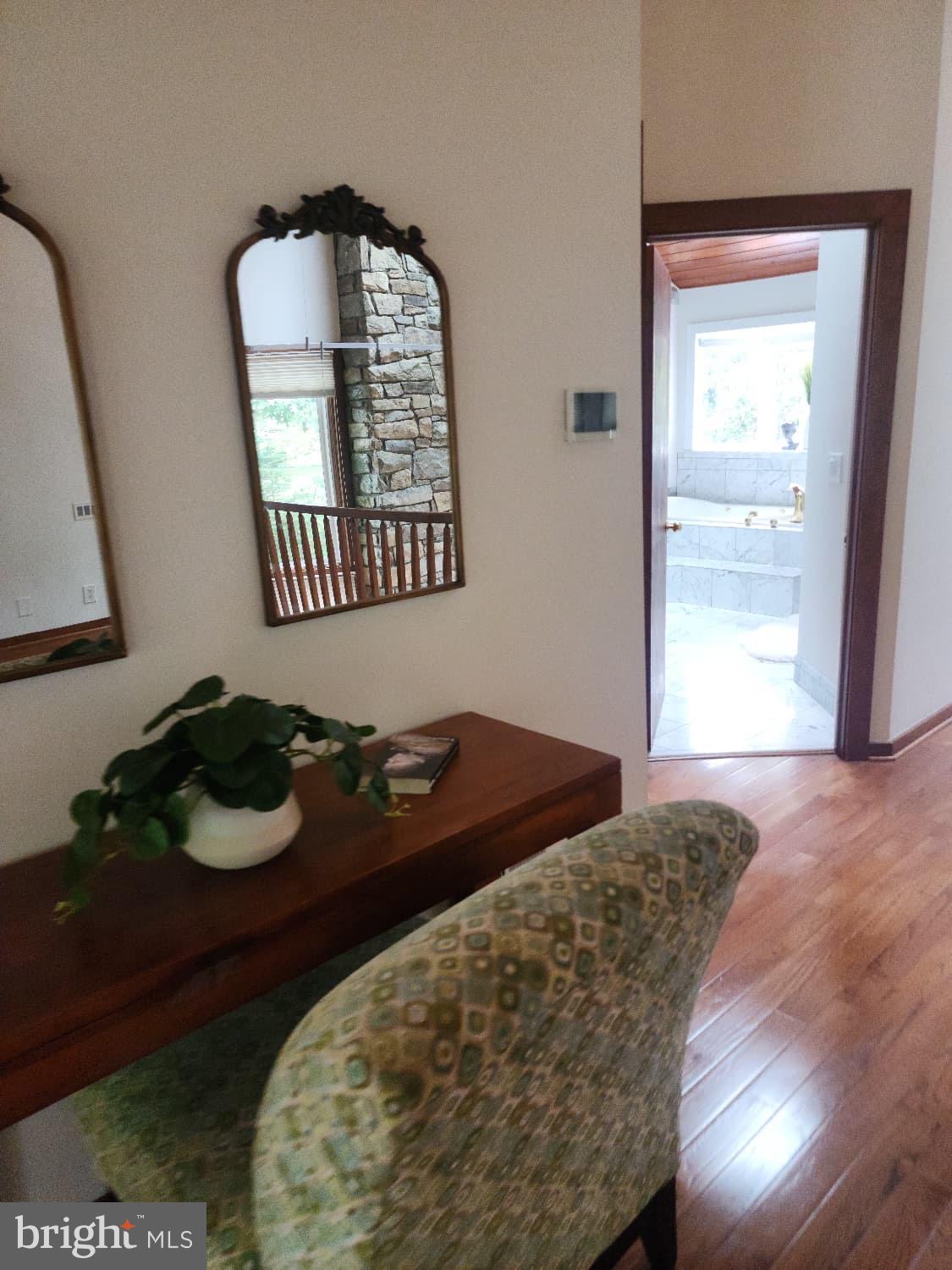 416 Marshall Manor Drive Silver Spring, MD 20905 - Photo 7 of 11 a bedroom with a bed and a mirror