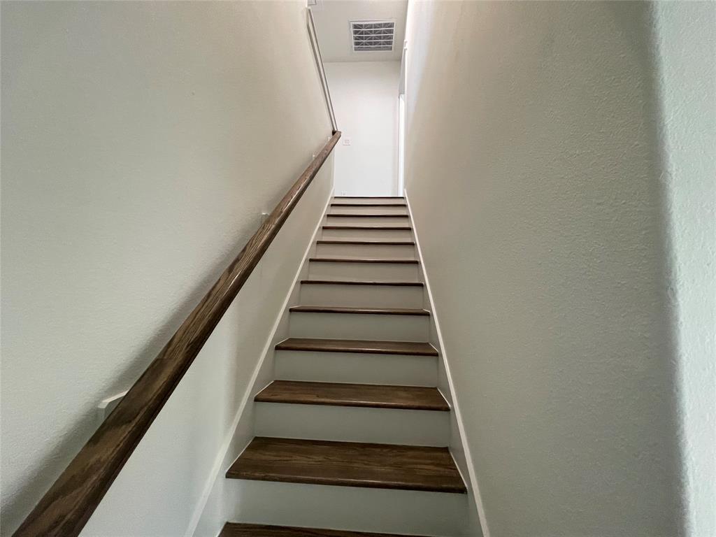 3535 Spring Avenue Dallas, TX 75210 - Photo 9 of 19 Stairs with a textured wall