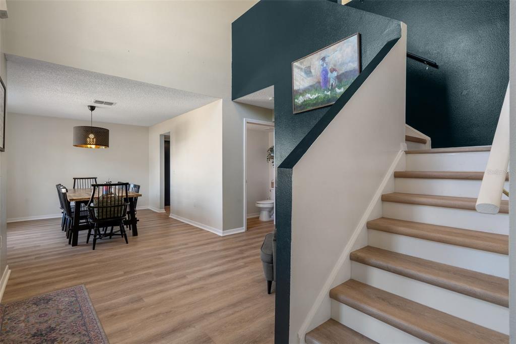 11258 Lomita Wren Road Weeki Wachee, FL 34614 - Photo 4 of 44 a view of entryway and dining room with furniture