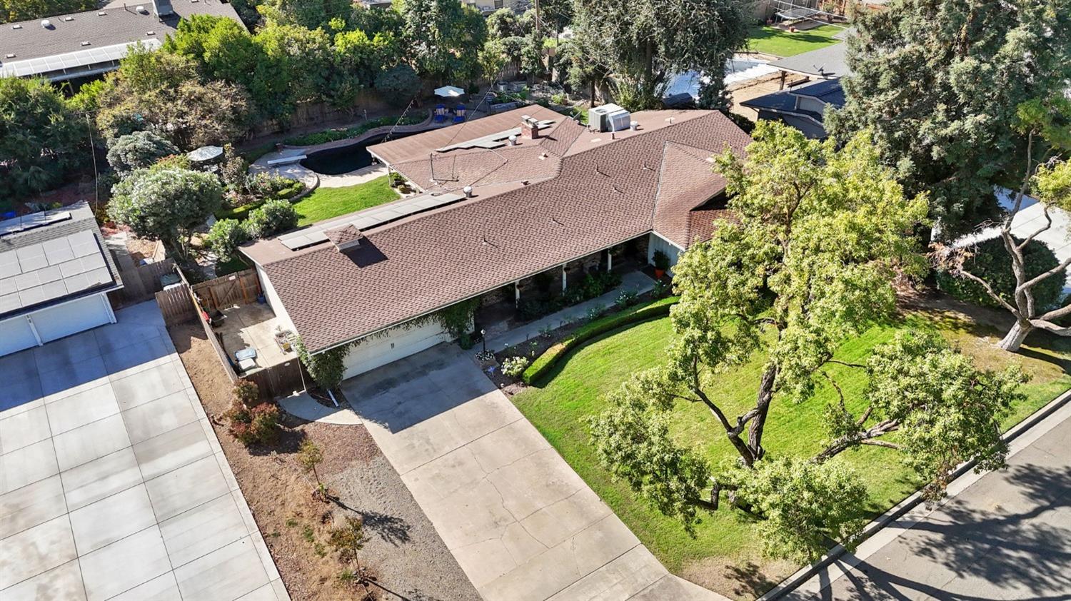 1323 West San Ramon Avenue Fresno, CA 93711 - Photo 25 of 30 an aerial view of a swimming pool with outdoor seating
