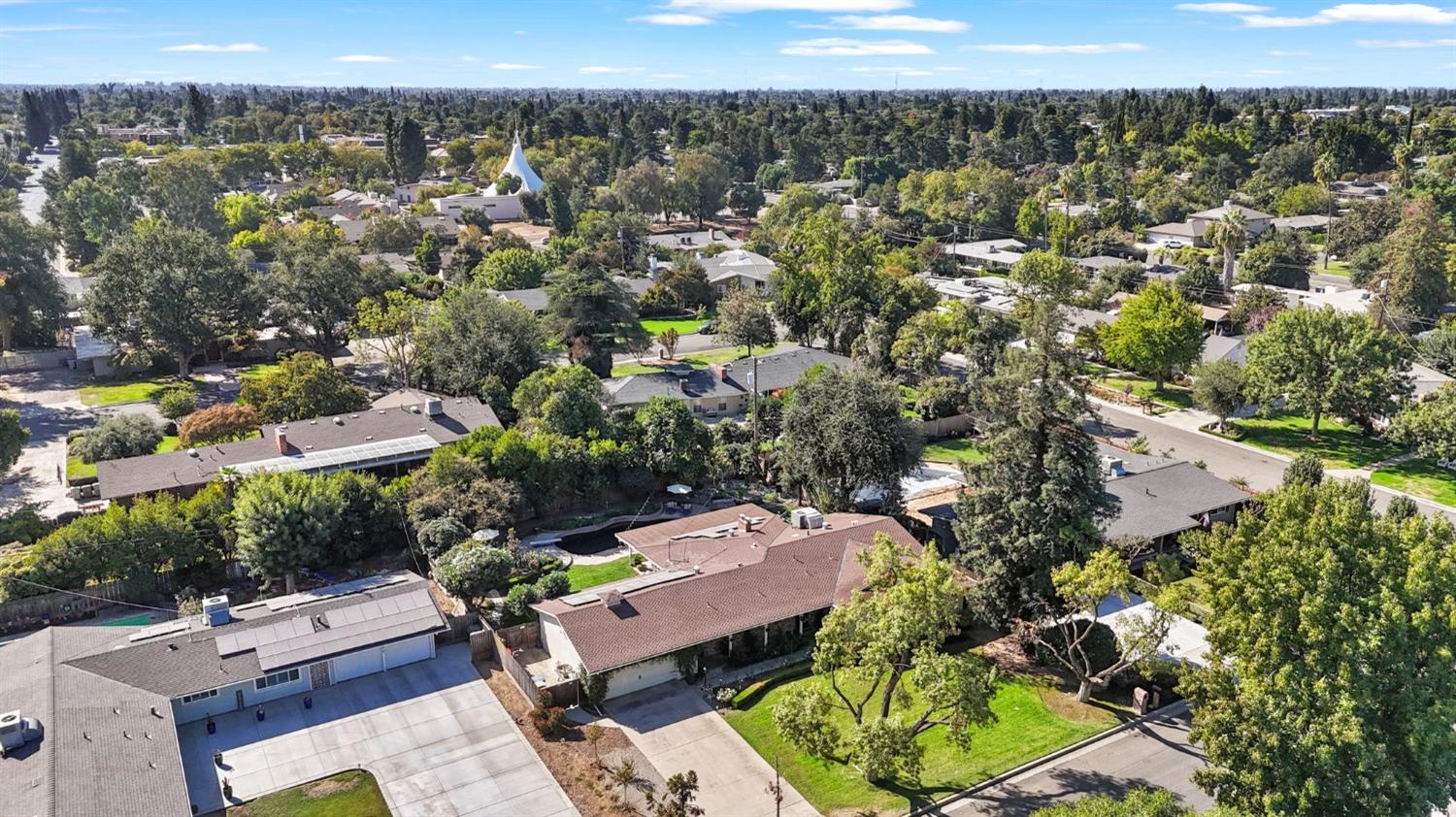 1323 West San Ramon Avenue Fresno, CA 93711 - Photo 27 of 30 an aerial view of a residential houses with outdoor space and street view