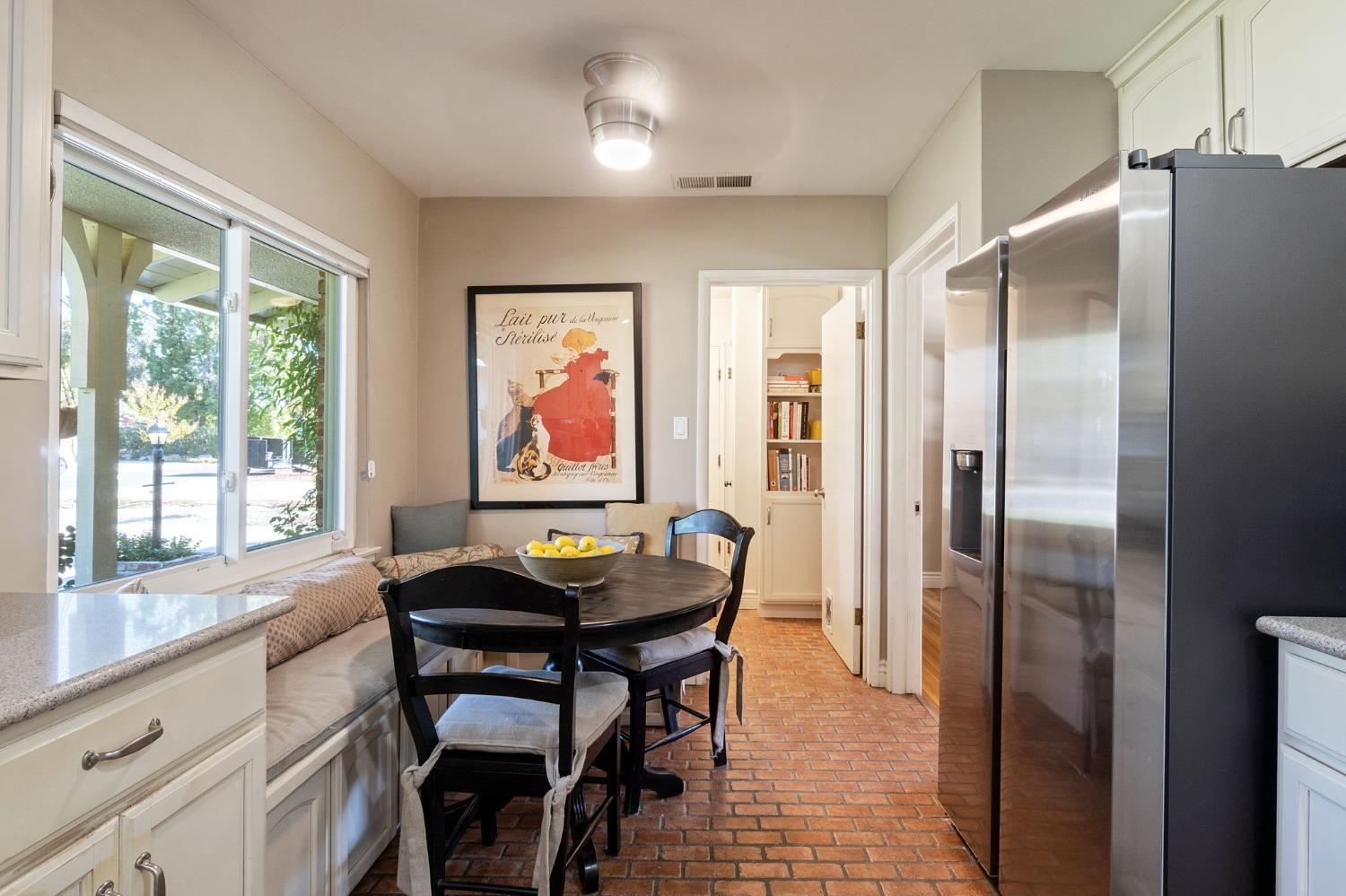 1323 West San Ramon Avenue Fresno, CA 93711 - Photo 9 of 30 a kitchen with stainless steel appliances granite countertop a refrigerator a sink a stove and a refrigerator with wooden floor