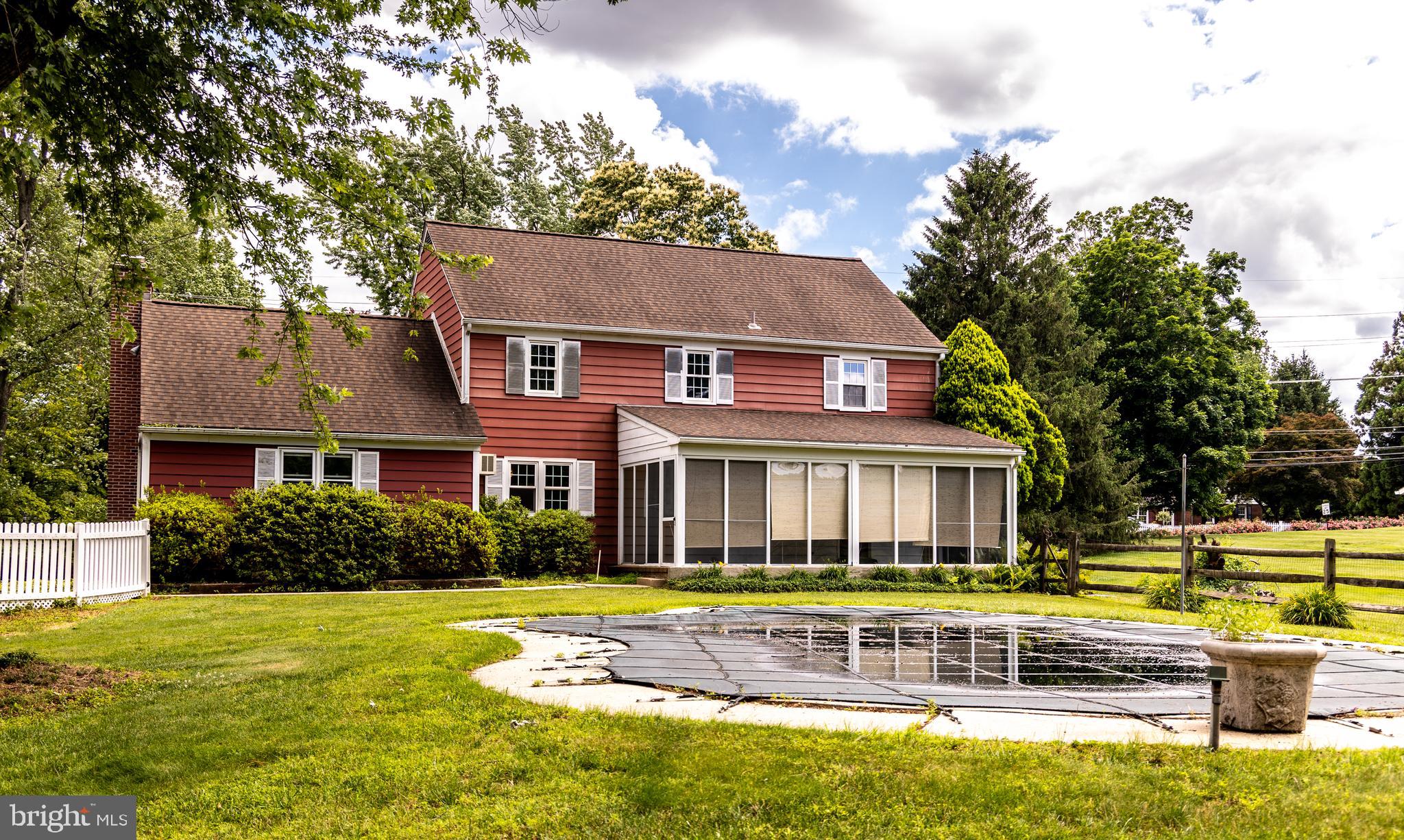 1929 Hillendale Road Chadds Ford, PA 19317 - Photo 7 of 56 front view of a house with a swimming pool