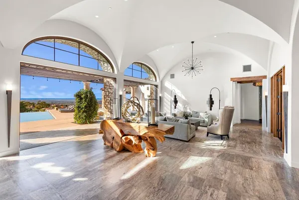 a view of a dining room with furniture window and outside view