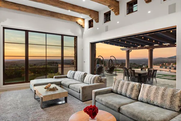 a kitchen with a stove a refrigerator and a dining table