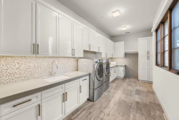 a bedroom with a bed and a lamp on table