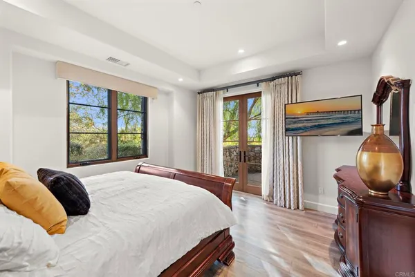 a living room with furniture a table and large window