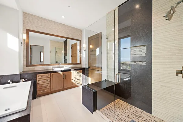 a view of a balcony with chair and potted plants
