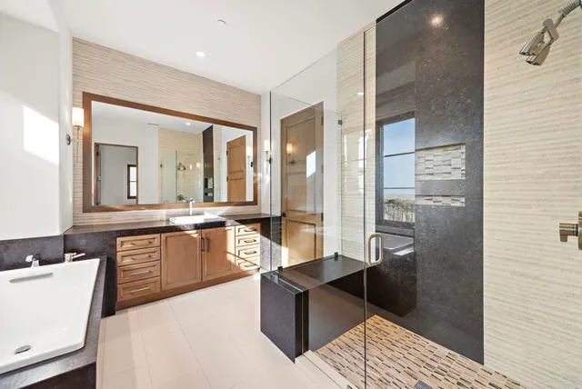 a view of a balcony with chair and potted plants