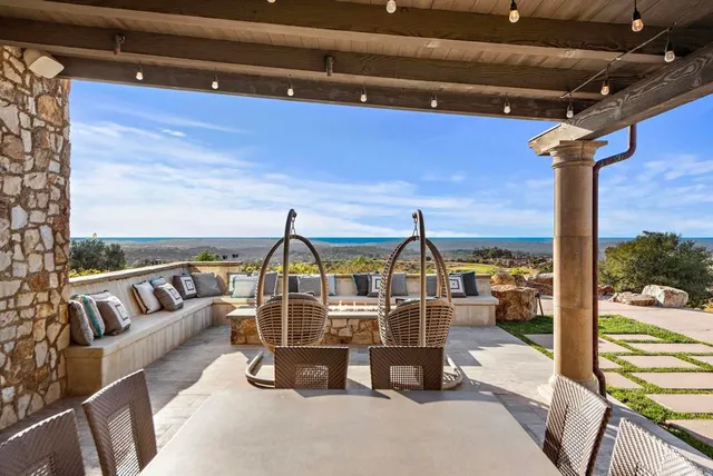 a view of a chairs and table in a patio
