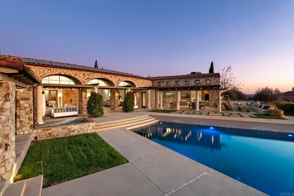 a view of a patio with swimming pool and patio
