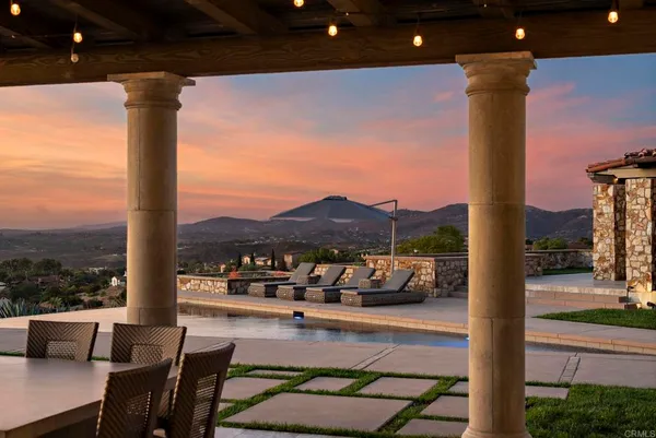 a view of living room with furniture and a floor to ceiling window