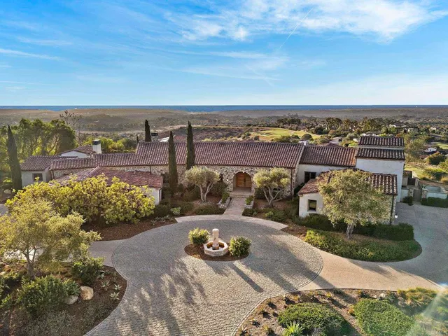 a view of a swimming pool with an outdoor seating