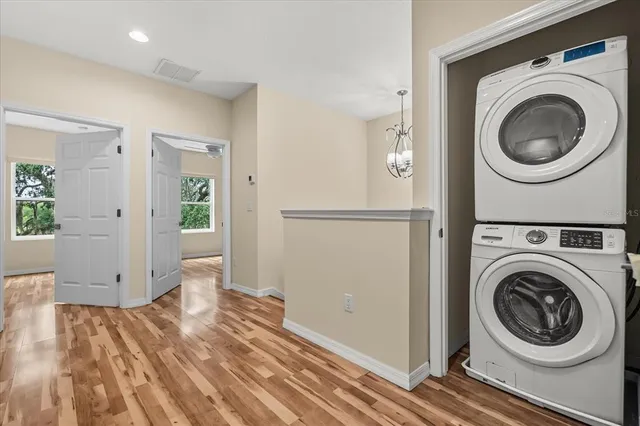 a view of a hallway with washer and dryer