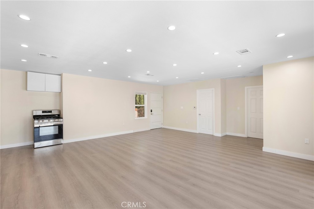 8435 Rincon Avenue Sun Valley, CA 91352 - Photo 6 of 61 a view of empty room with wooden floor