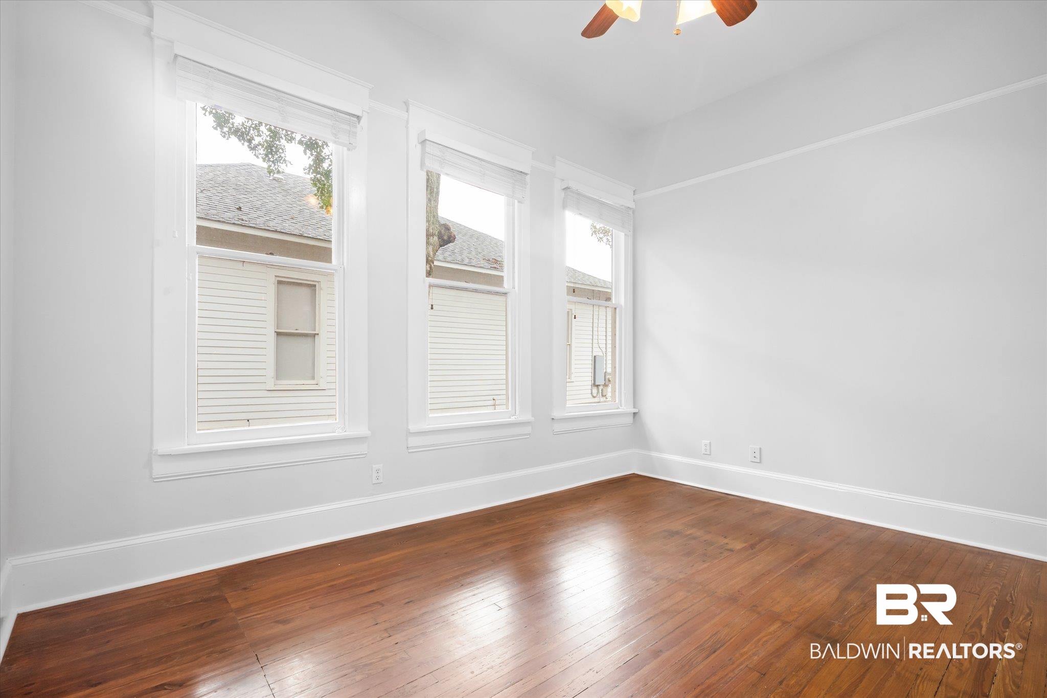 14 South Monterey Street Mobile, AL 36604 - Photo 34 of 41 Spare room featuring hardwood / wood-style floors and ceiling fan