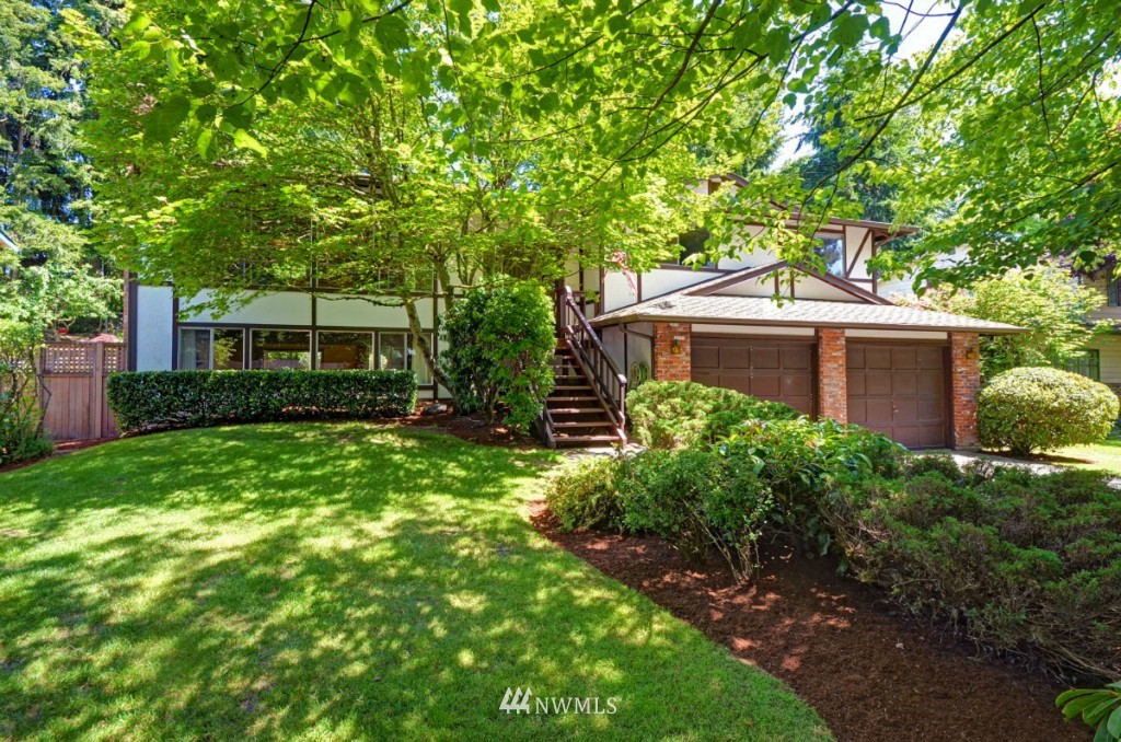16631 24th Drive Southeast Bothell, WA 98012 - Photo 1 of 24 a front view of a house with garden