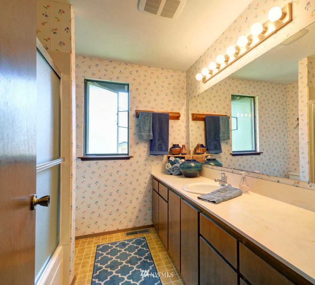 16631 24th Drive Southeast Bothell, WA 98012 - Photo 12 of 24 a bathroom with a sink and a mirror