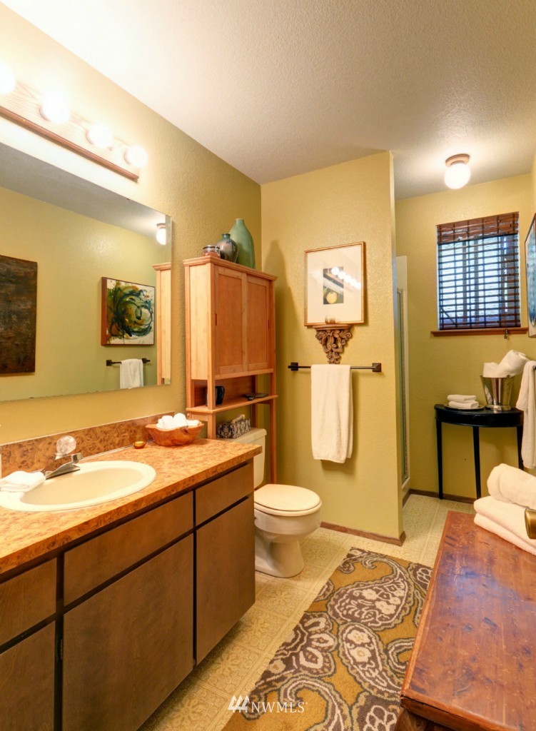 16631 24th Drive Southeast Bothell, WA 98012 - Photo 17 of 24 a bathroom with a sink toilet and shower