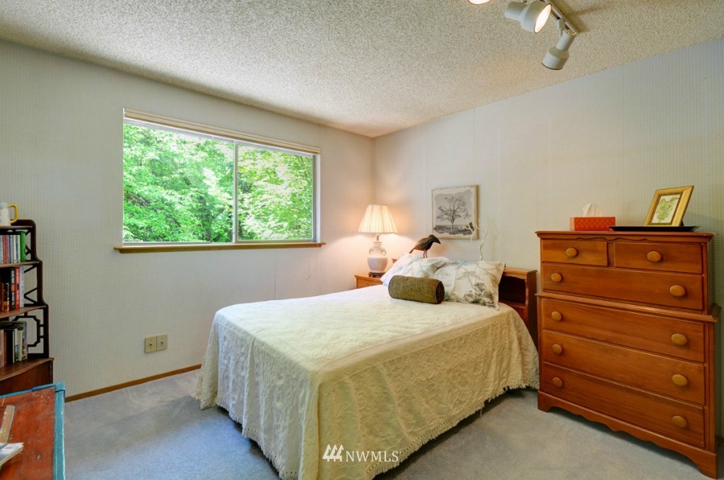 16631 24th Drive Southeast Bothell, WA 98012 - Photo 20 of 24 a bedroom with a bed and a dresser