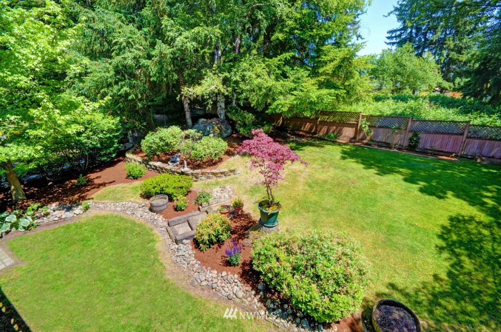 16631 24th Drive Southeast Bothell, WA 98012 - Photo 21 of 24 a view of a garden with plants and large trees
