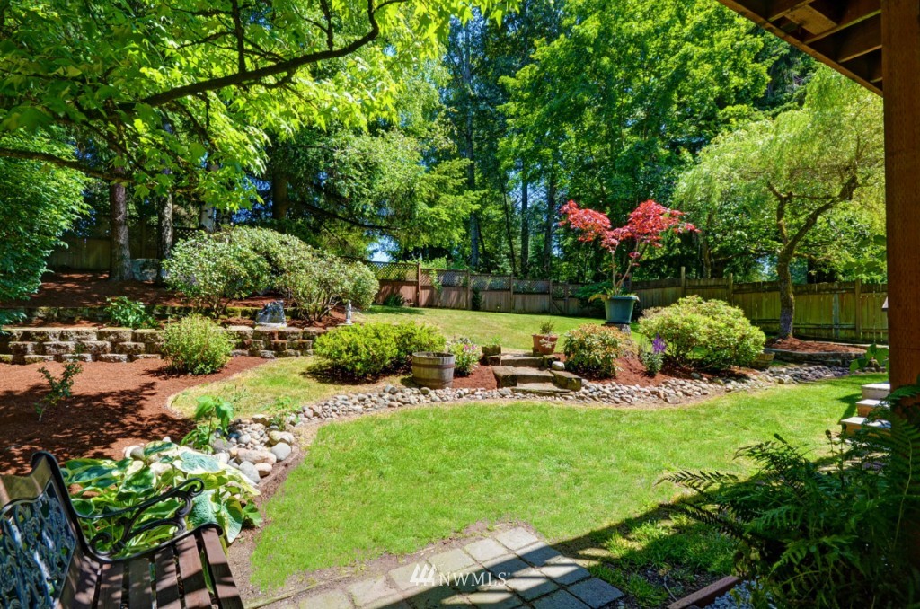 16631 24th Drive Southeast Bothell, WA 98012 - Photo 24 of 24 a view of a garden with plants and large trees